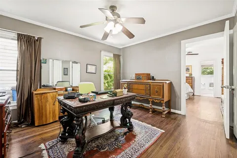 a workspace with furniture and wooden floor