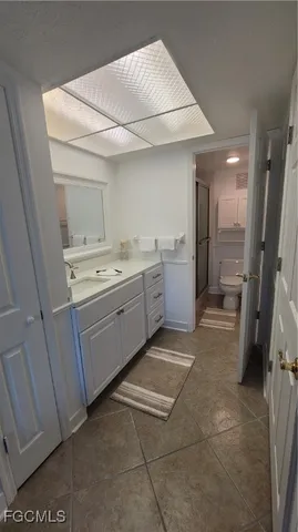 a utility room with cabinets washer and dryer