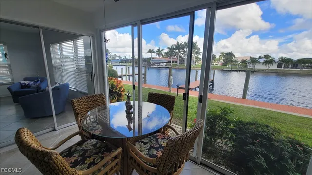 a view of a balcony with chairs and a table