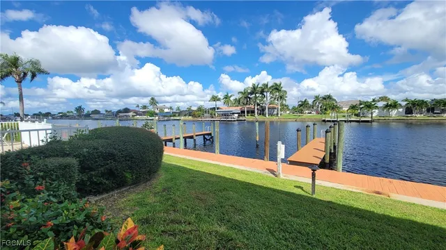 a large body of water with a building in the background