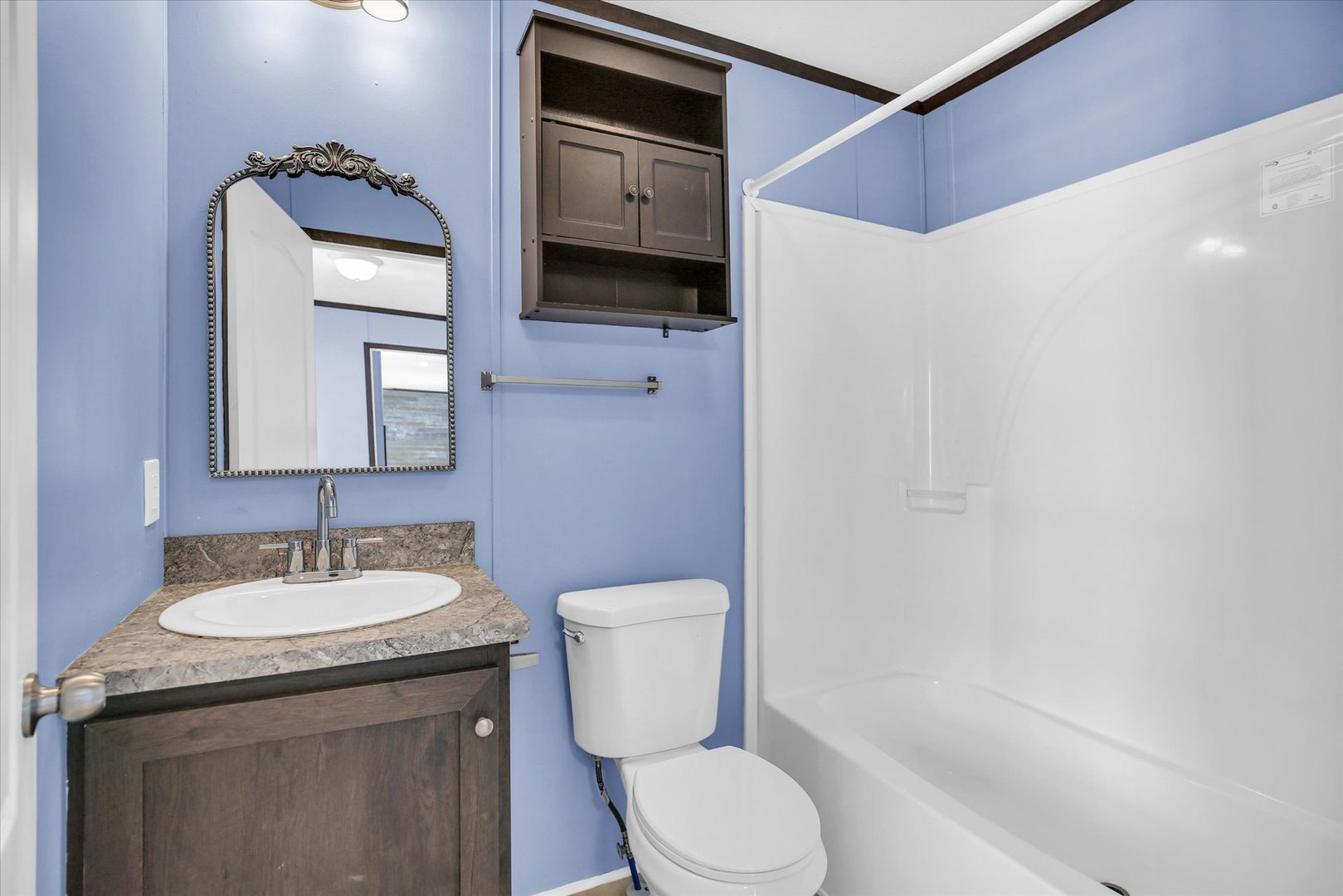 1216 Sycamore Lane Rantoul, IL 61866 - Photo 14 of 26 a bathroom with a toilet sink and mirror