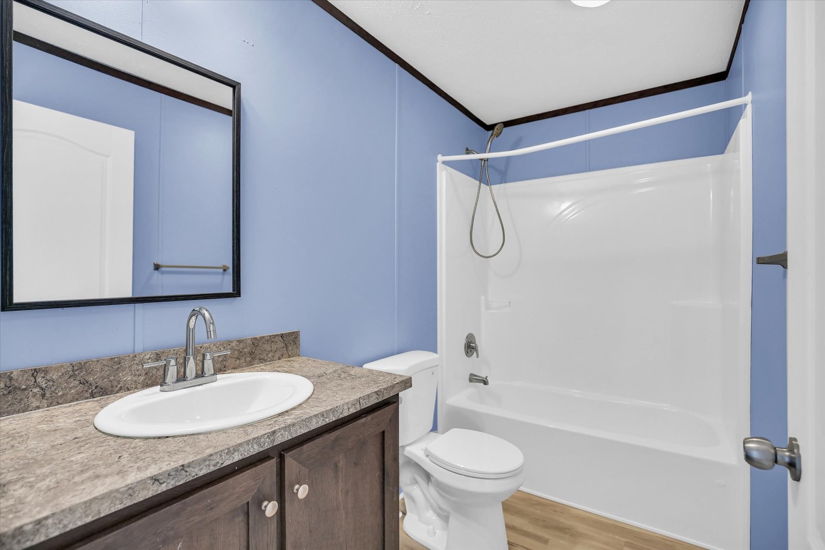 1216 Sycamore Lane Rantoul, IL 61866 - Photo 19 of 26 a bathroom with a granite countertop sink toilet and shower