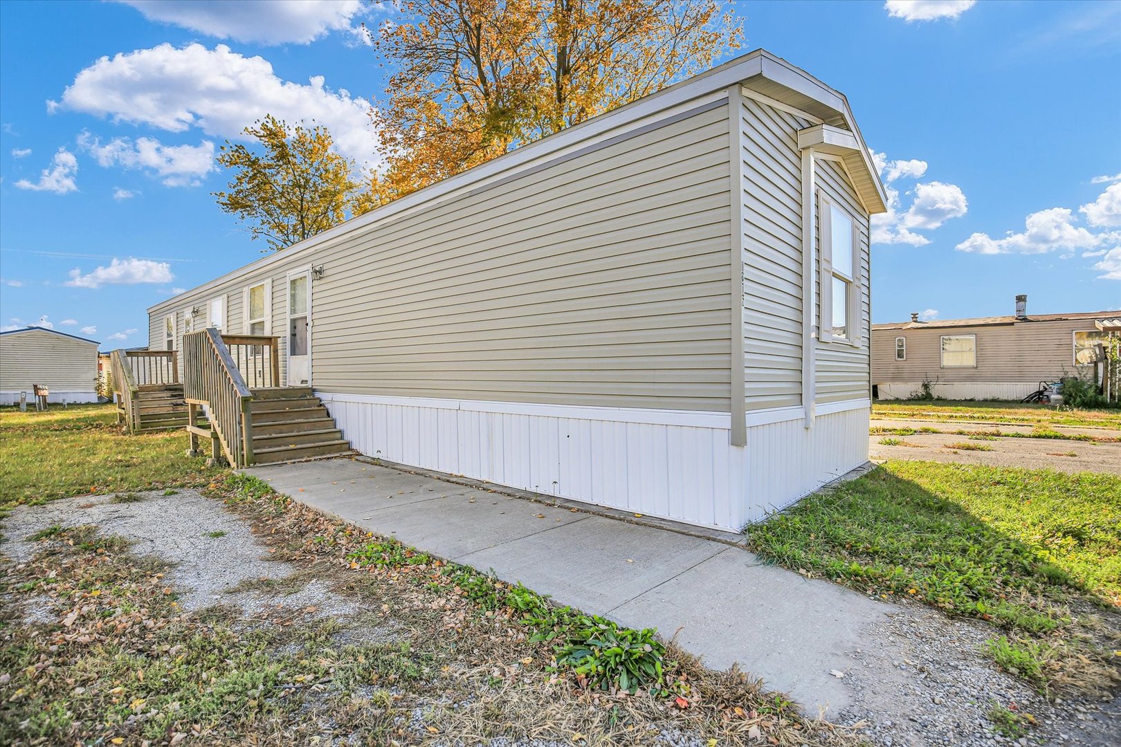 1216 Sycamore Lane Rantoul, IL 61866 - Photo 2 of 26 a view of a backyard with pathway
