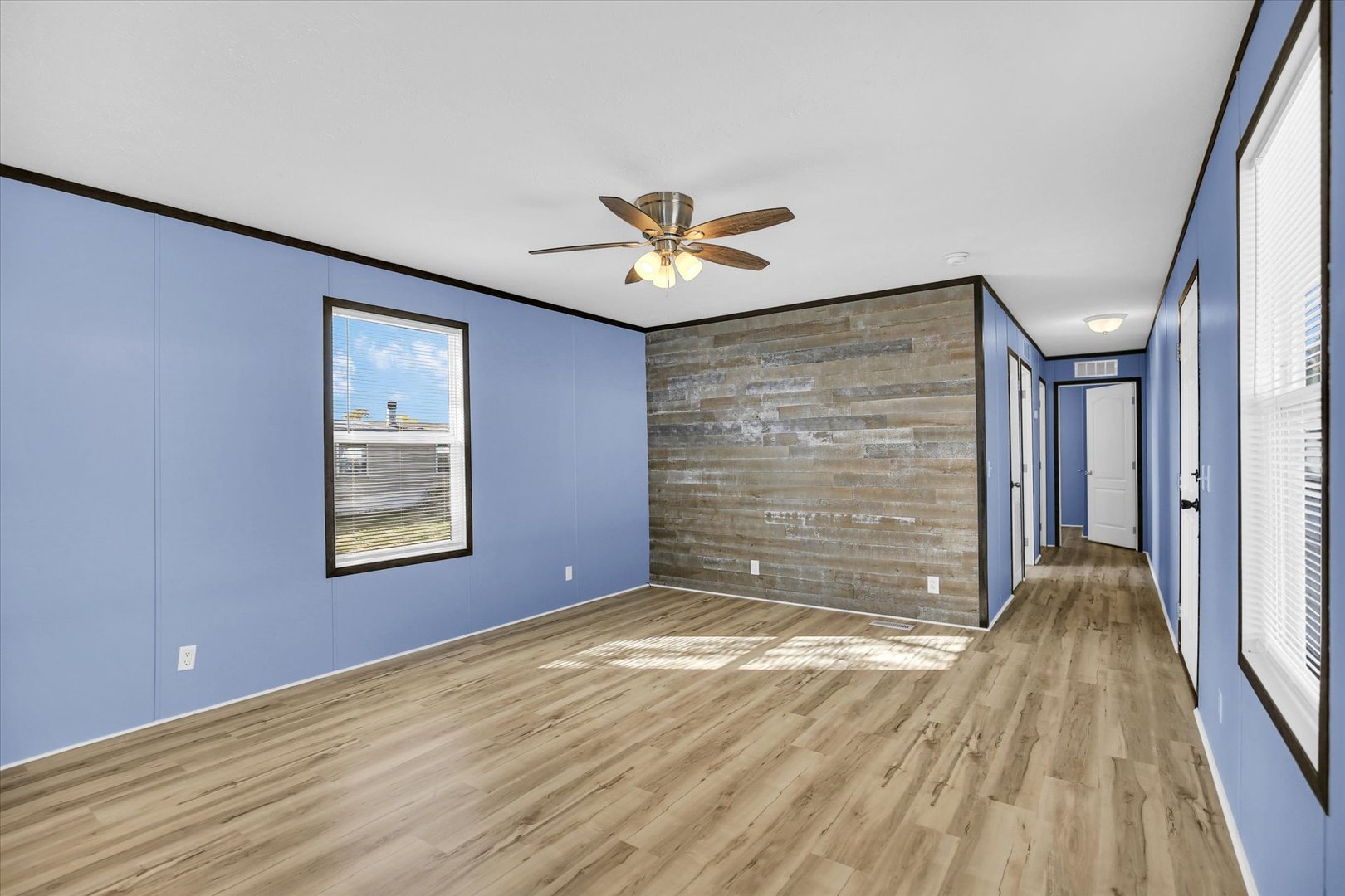 1216 Sycamore Lane Rantoul, IL 61866 - Photo 6 of 26 a view of an empty room with a window and a fireplace