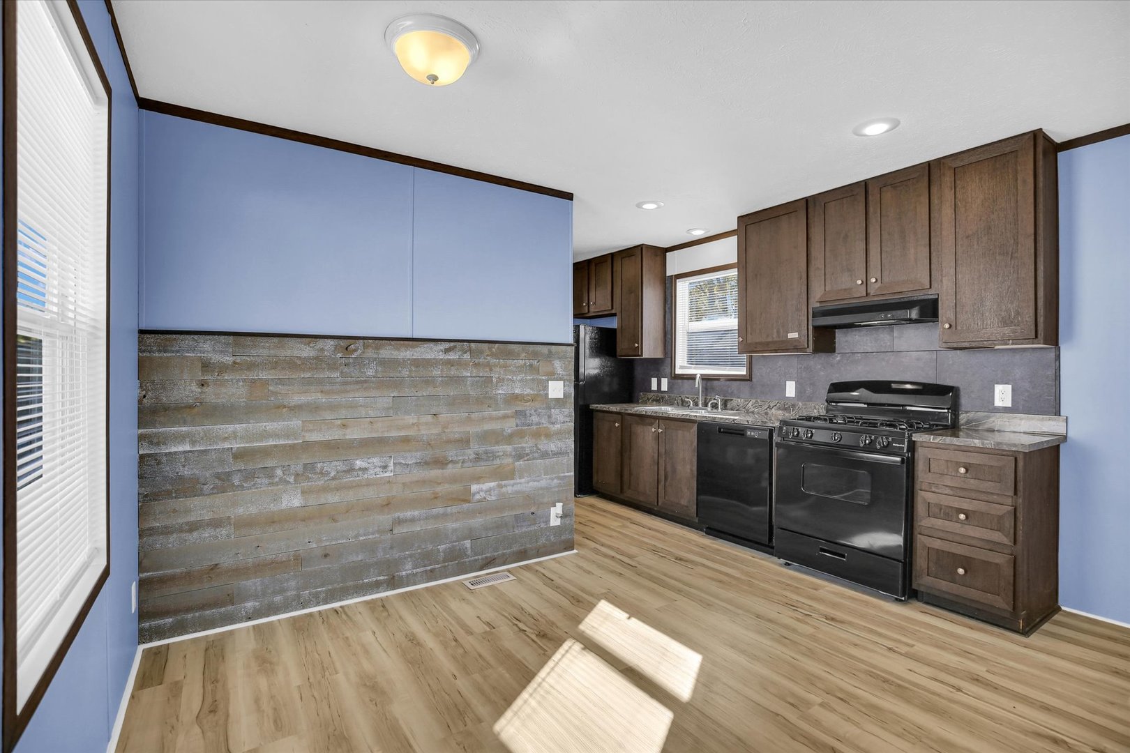 1216 Sycamore Lane Rantoul, IL 61866 - Photo 7 of 26 a kitchen with wooden cabinets and a stove top oven