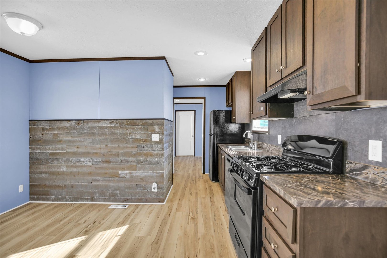 1216 Sycamore Lane Rantoul, IL 61866 - Photo 9 of 26 a kitchen with stainless steel appliances granite countertop a stove and a refrigerator