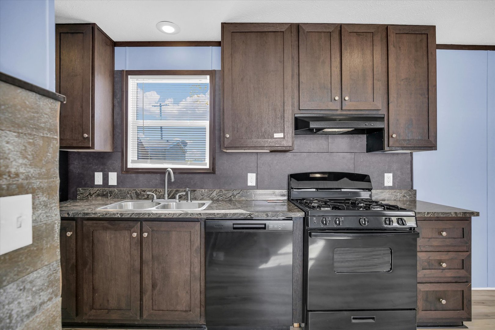1216 Sycamore Lane Rantoul, IL 61866 - Photo 10 of 26 a kitchen with stainless steel appliances granite countertop wooden cabinets and a stove top oven
