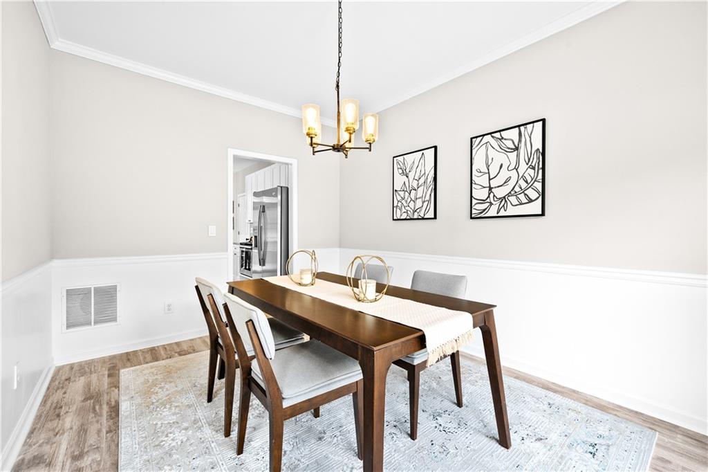 3720 Brookefall Landing Suwanee, GA 30024 - Photo 12 of 41 a view of a dining room with furniture