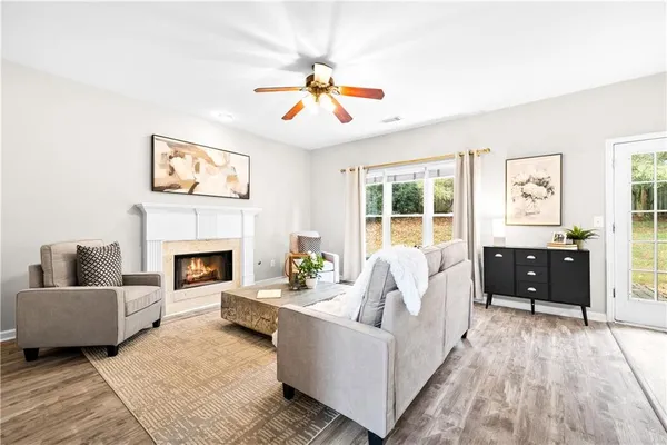 a living room with furniture and a fireplace