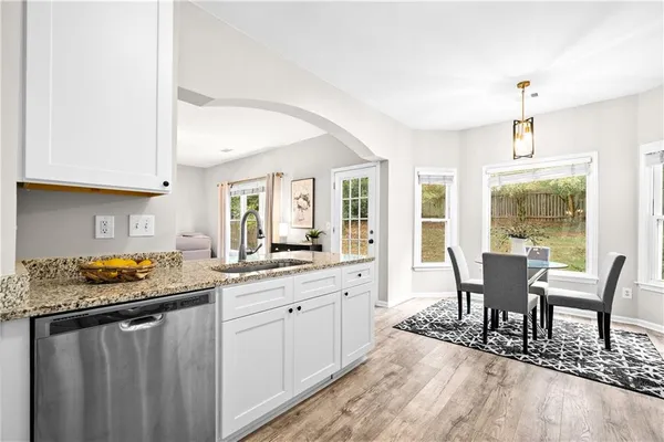 a view of a dining room with furniture window and wooden floor