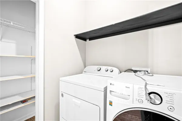 a view of hallway with wooden floor