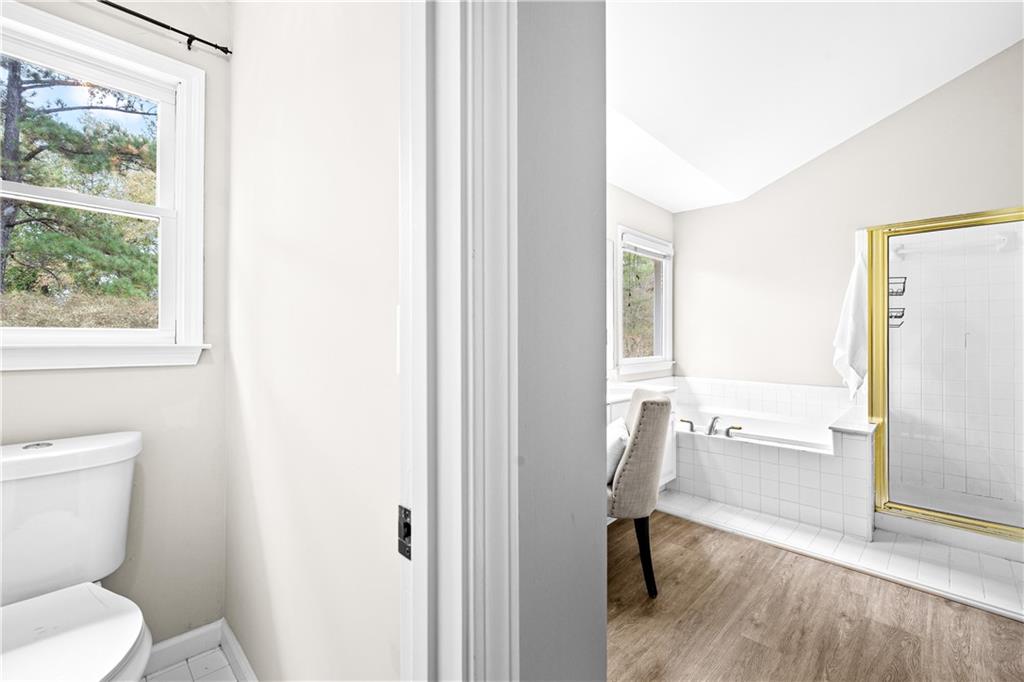3720 Brookefall Landing Suwanee, GA 30024 - Photo 26 of 41 a bathroom with a toilet and a bathtub