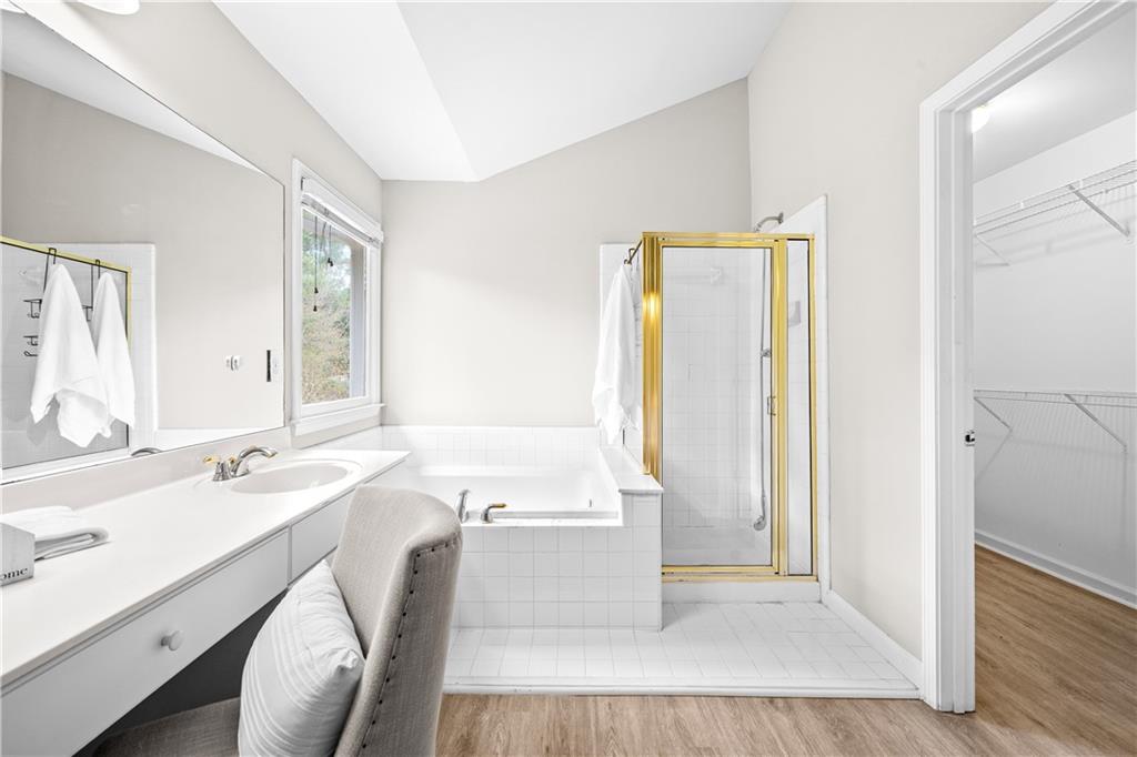 3720 Brookefall Landing Suwanee, GA 30024 - Photo 27 of 41 a bathroom with a tub sink and a mirror