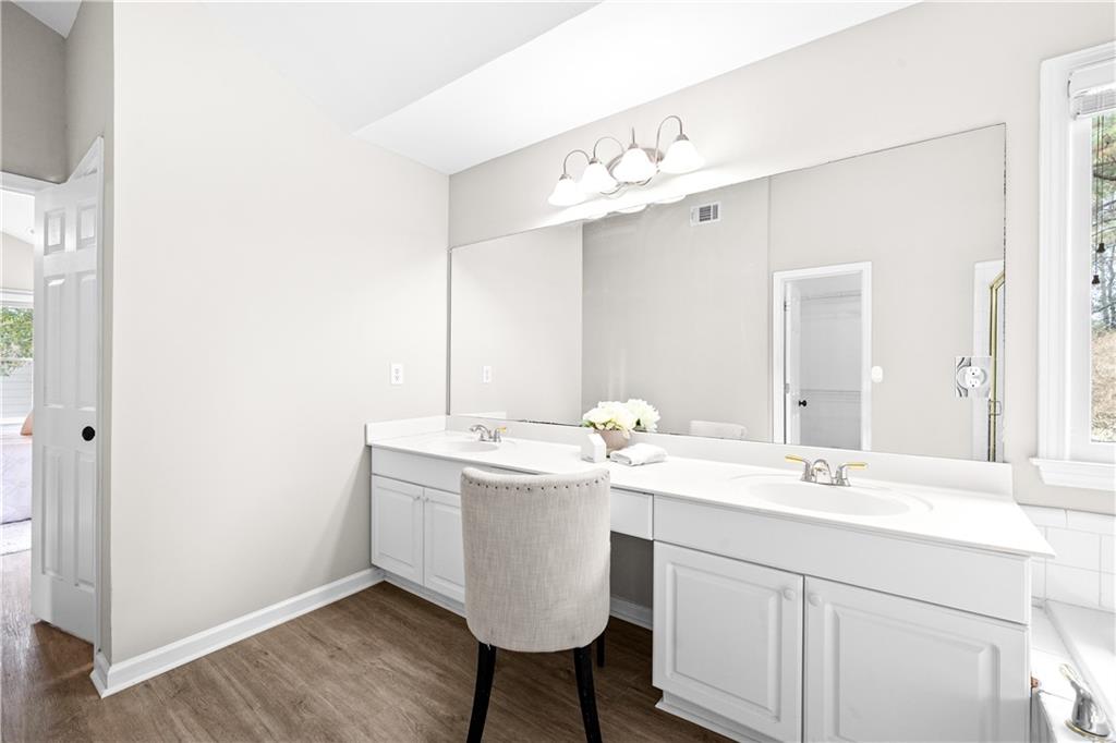 3720 Brookefall Landing Suwanee, GA 30024 - Photo 28 of 41 a bathroom with a sink and a mirror