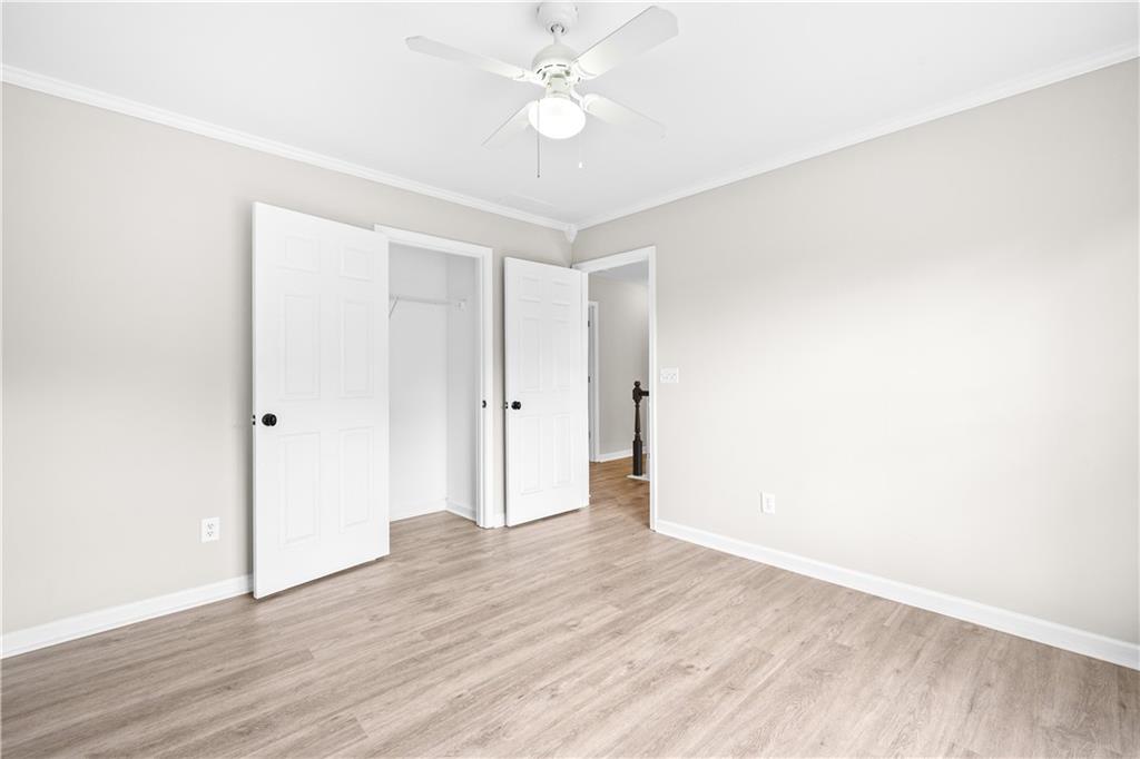 3720 Brookefall Landing Suwanee, GA 30024 - Photo 31 of 41 a view of an empty room with wooden floor
