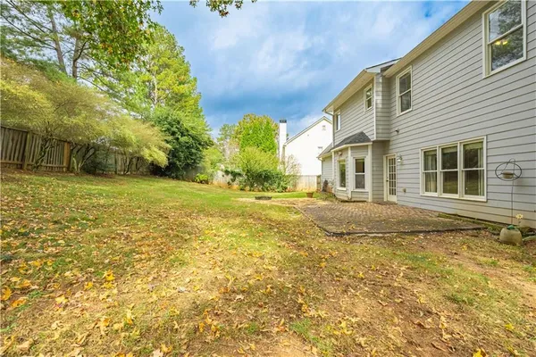 an aerial view of a house with swimming pool