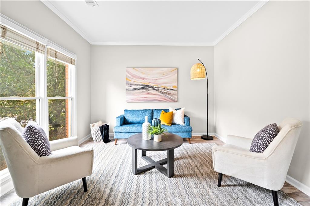 3720 Brookefall Landing Suwanee, GA 30024 - Photo 6 of 41 a living room with furniture and a large window