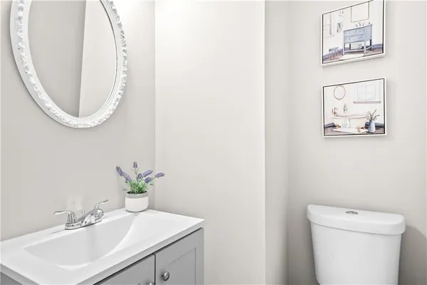 a view of a dining room with furniture wooden floor and a chandelier