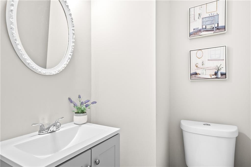 3720 Brookefall Landing Suwanee, GA 30024 - Photo 9 of 41 a bathroom with a sink and a mirror