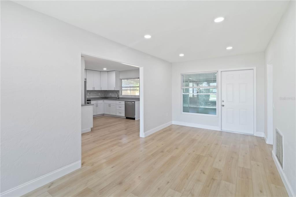 5337 60th Street North Kenneth City, FL 33709 - Photo 11 of 29 a view of a kitchen with a sink and a refrigerator