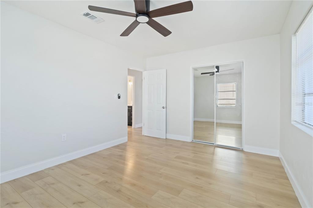 5337 60th Street North Kenneth City, FL 33709 - Photo 20 of 29 wooden floor in an empty room