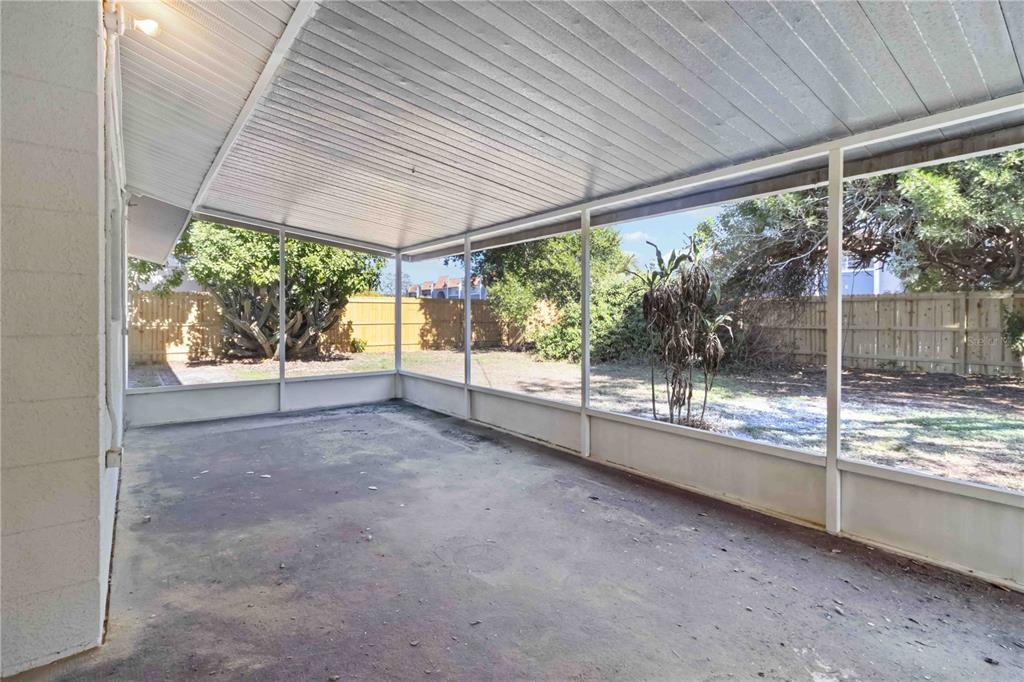 5337 60th Street North Kenneth City, FL 33709 - Photo 22 of 29 a view of a yard with porch and outdoor seating