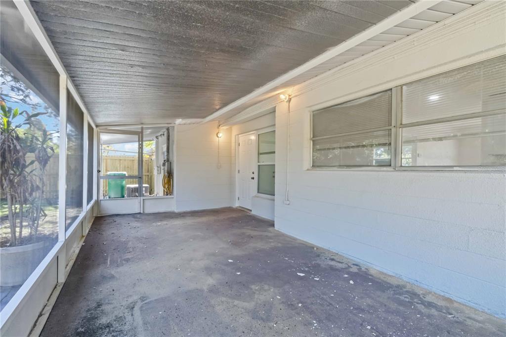 5337 60th Street North Kenneth City, FL 33709 - Photo 24 of 29 a view of a hallway with windows