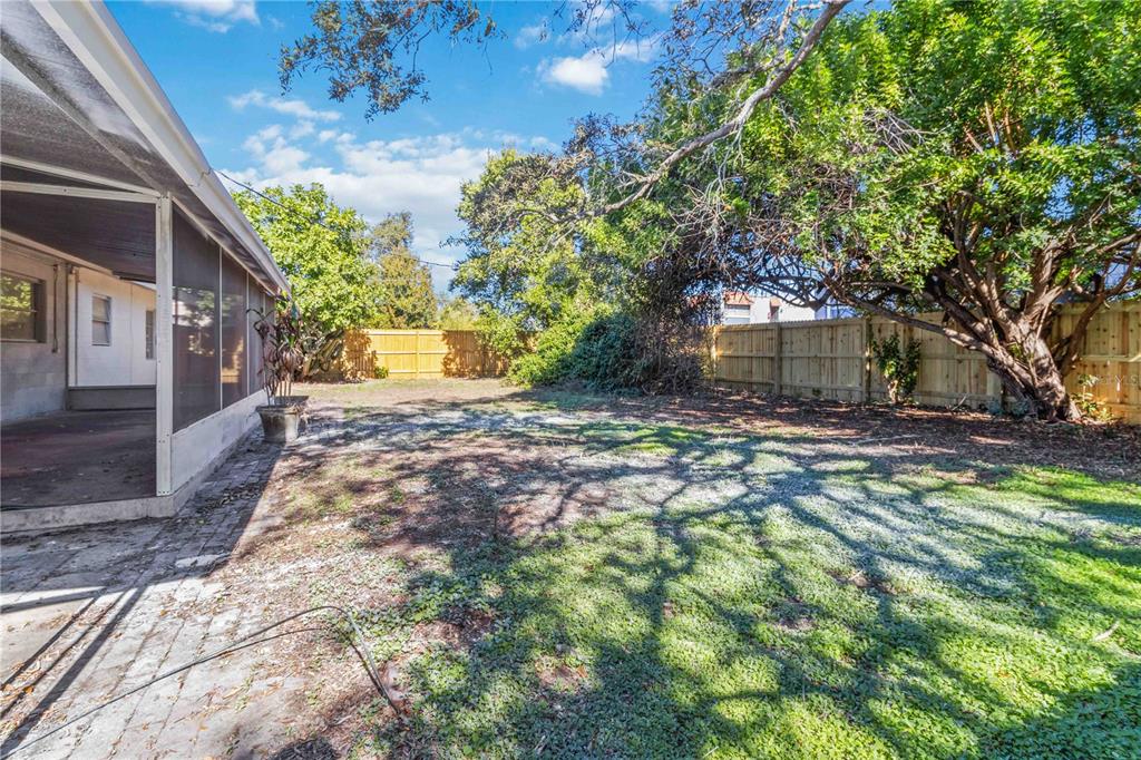 5337 60th Street North Kenneth City, FL 33709 - Photo 26 of 29 a view of a yard with plants and large trees
