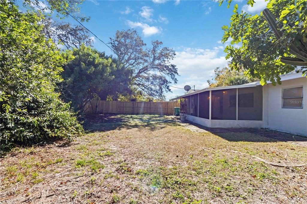 5337 60th Street North Kenneth City, FL 33709 - Photo 29 of 29 a yard with trees in the background