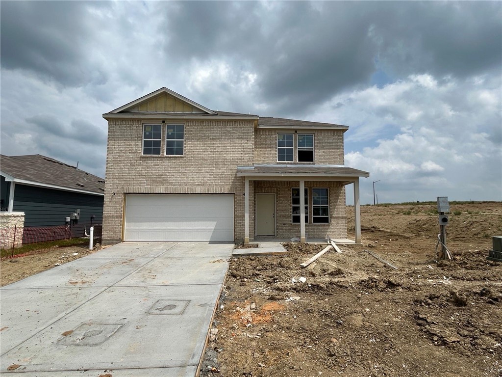 4490 Wisenbaker Way Bryan, TX 77845 - Photo 2 of 7 a front view of a house with garden