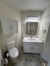 700 Auburndale Drive Euless, TX 76040 - Photo 2 of 7 a bathroom with a toilet sink and mirror