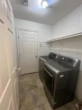 a utility room with washer and dryer