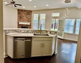 700 Auburndale Drive Euless, TX 76040 - Photo 6 of 7 a kitchen with a sink stove and cabinets