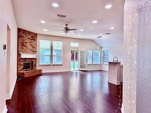 700 Auburndale Drive Euless, TX 76040 - Photo 7 of 7 a view of an empty room with wooden floor and a window