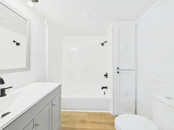 a bathroom with a sink and toilet
