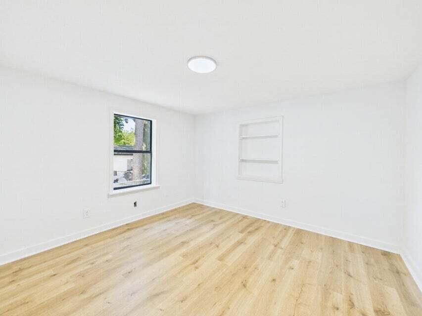 412 Church Street Crestview, FL 32539 - Photo 14 of 19 an empty room with a window