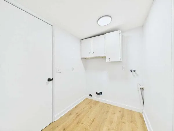 a view of a room with white walls