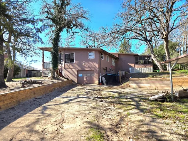 a view of a house with snow on the road