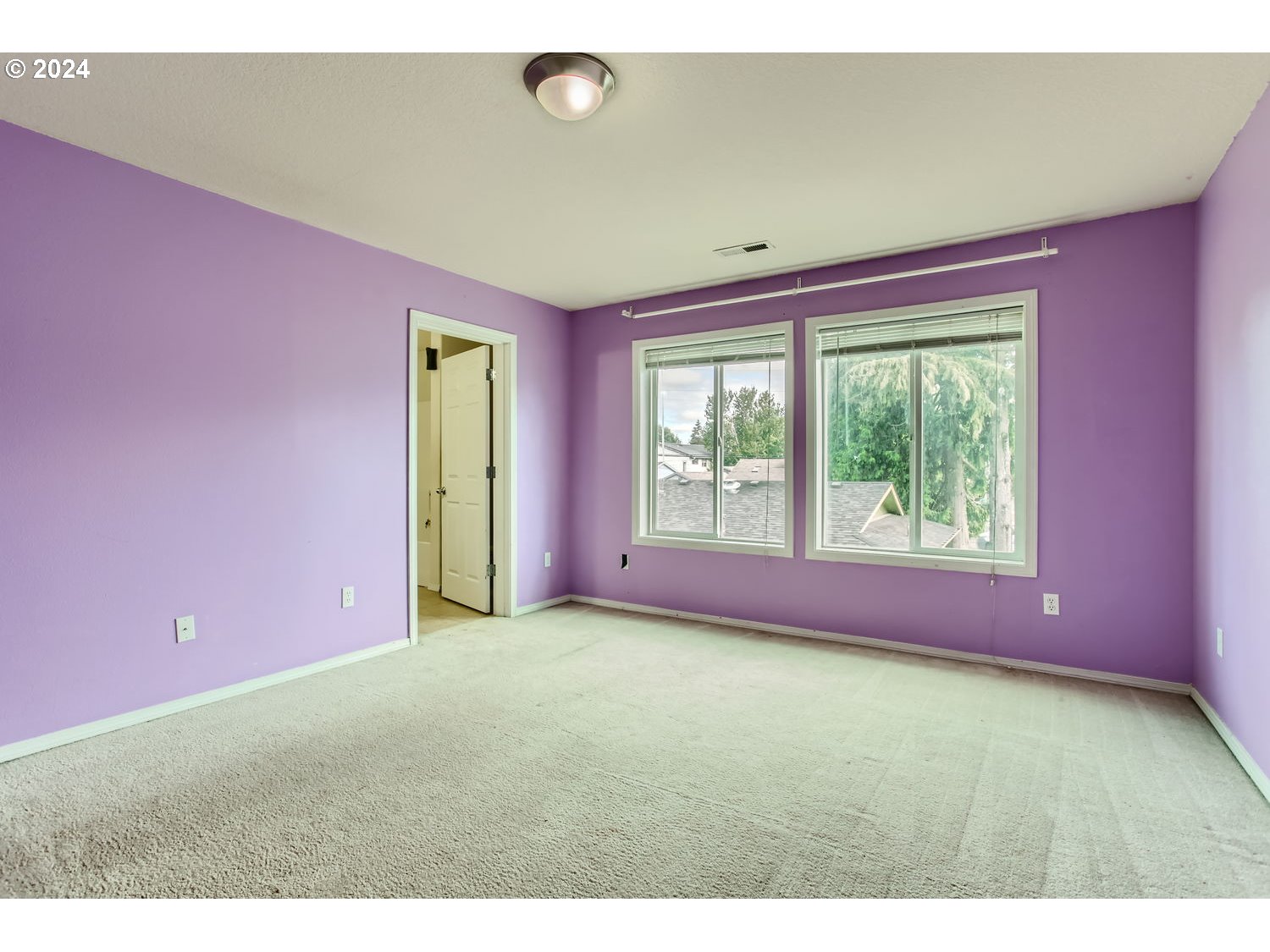 11405 Southeast Clinton Street Portland, OR 97266 - Photo 15 of 29 a big room with windows and closet