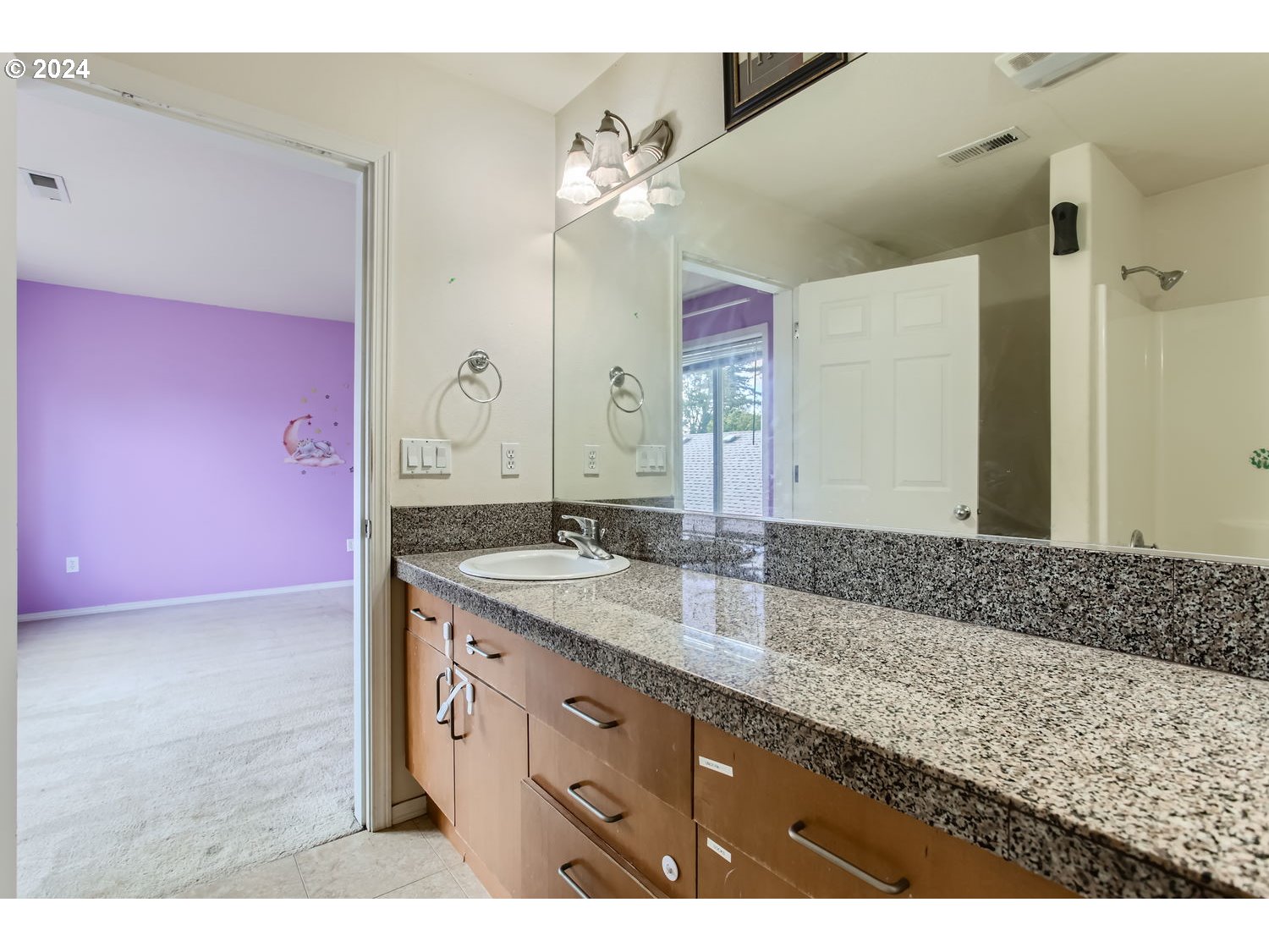 11405 Southeast Clinton Street Portland, OR 97266 - Photo 18 of 29 a bathroom with a granite countertop double vanity sink and a mirror