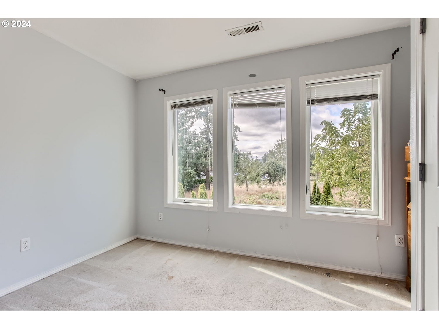 11405 Southeast Clinton Street Portland, OR 97266 - Photo 19 of 29 a view of an empty room with a window