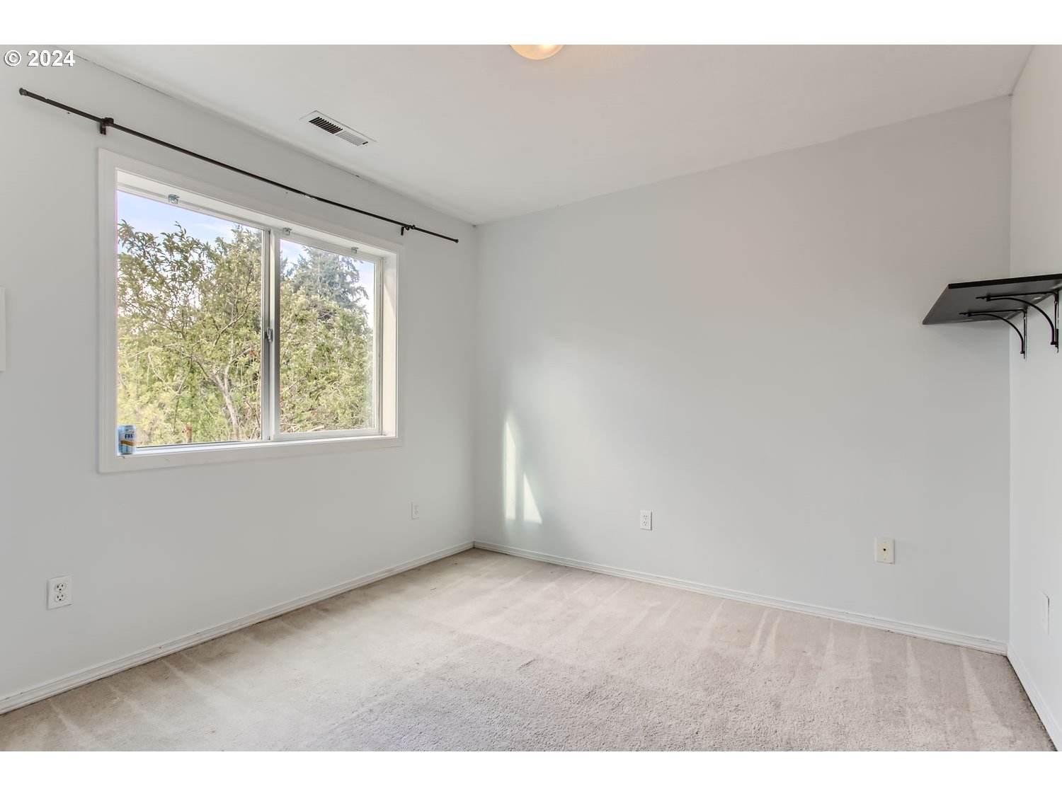 11405 Southeast Clinton Street Portland, OR 97266 - Photo 20 of 29 a view of an empty room with a window