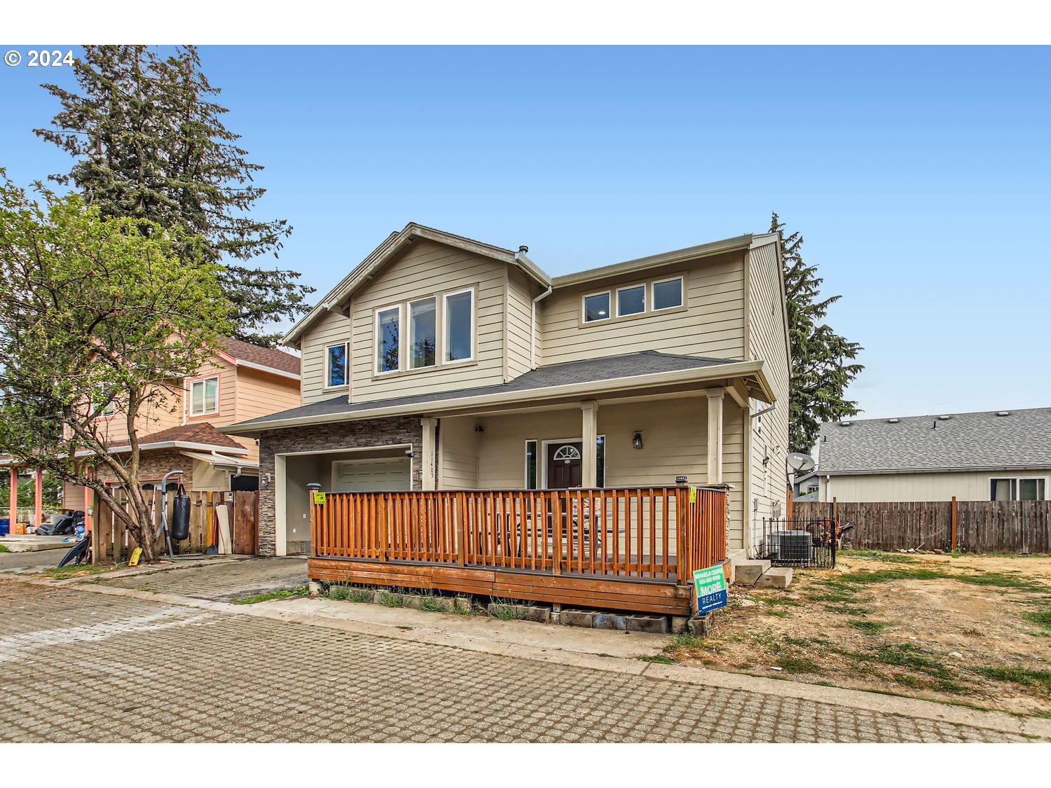 11405 Southeast Clinton Street Portland, OR 97266 - Photo 2 of 29 a view of a house with a balcony