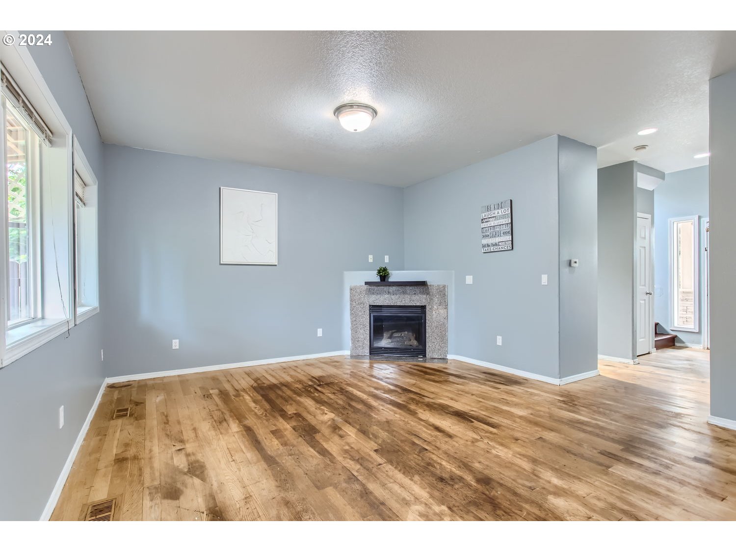 11405 Southeast Clinton Street Portland, OR 97266 - Photo 7 of 29 a view of empty room with furniture and fireplace