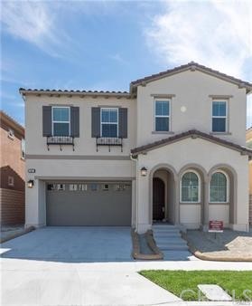 30 Lark Lake Forest, CA 92630 - Photo 1 of 1 a front view of a house with a garden