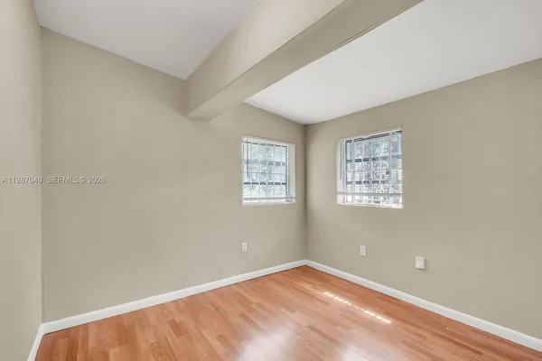 a view of an empty room with a window