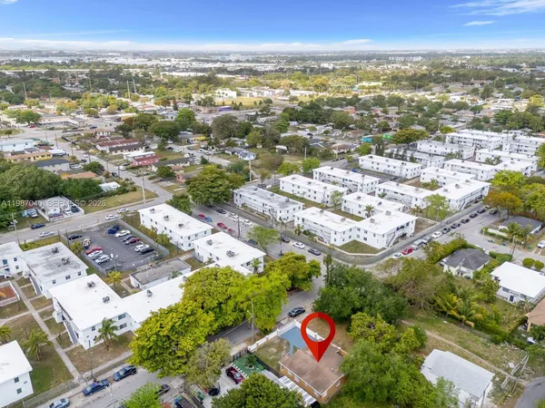 an aerial view of residential building and parking space