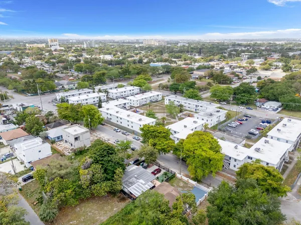 an aerial view of residential houses with outdoor space