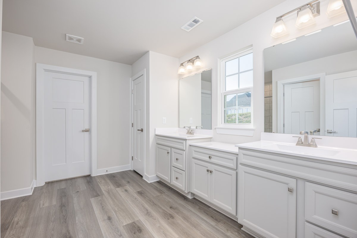968 Caywood Road Smyrna, TN 37167 - Photo 32 of 54 a spacious bathroom with a granite countertop sink mirror and a