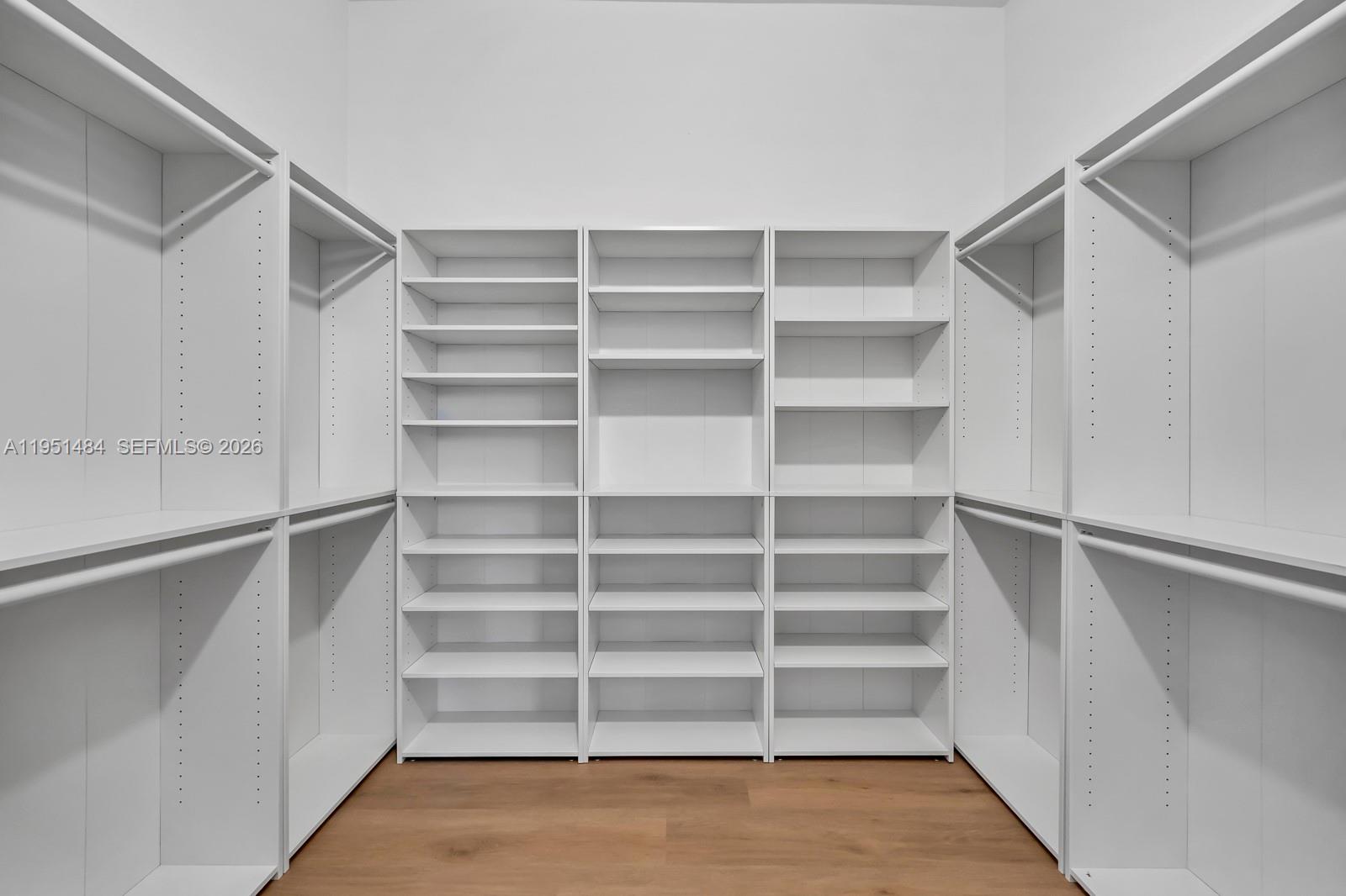 13067 Southwest 286th Street, Unit 13067 Homestead, FL 33033 - Photo 15 of 37 a view of walk in closet with empty racks